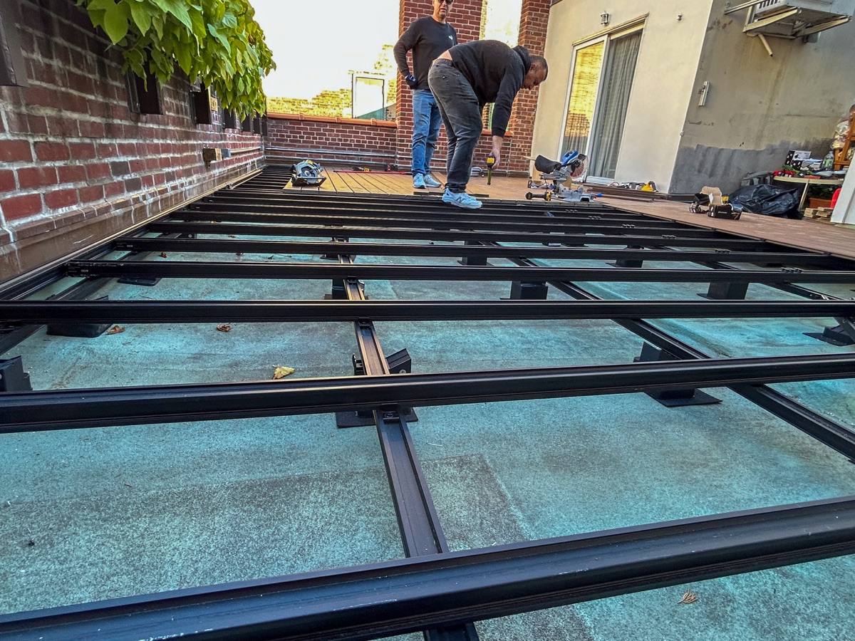BUILD IN NYC team installing rooftop deck framing for exterior construction