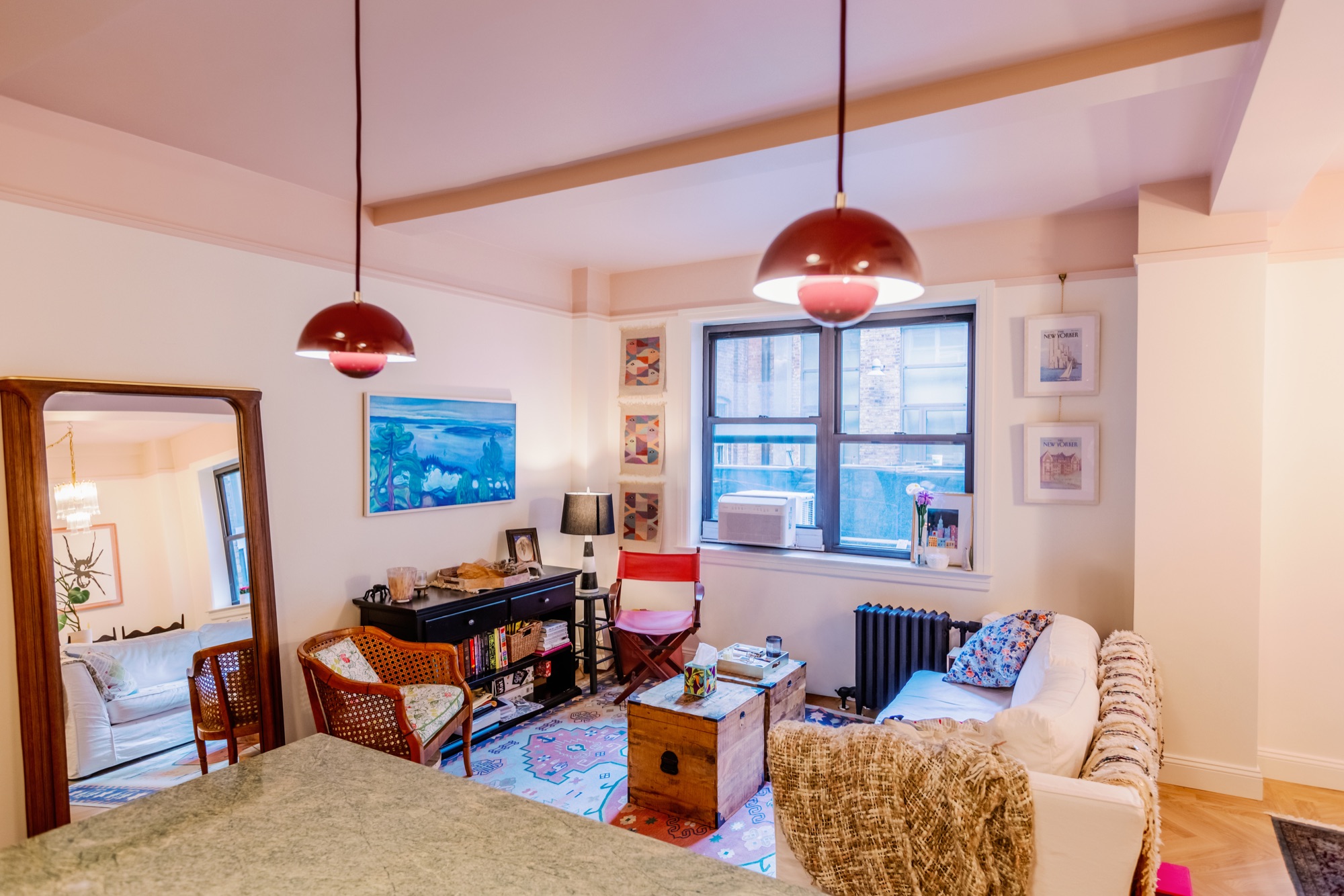 210 West 78th Street living room renovation with red pendant lights, custom millwork, and refined apartment finishes by BUILD IN NYC